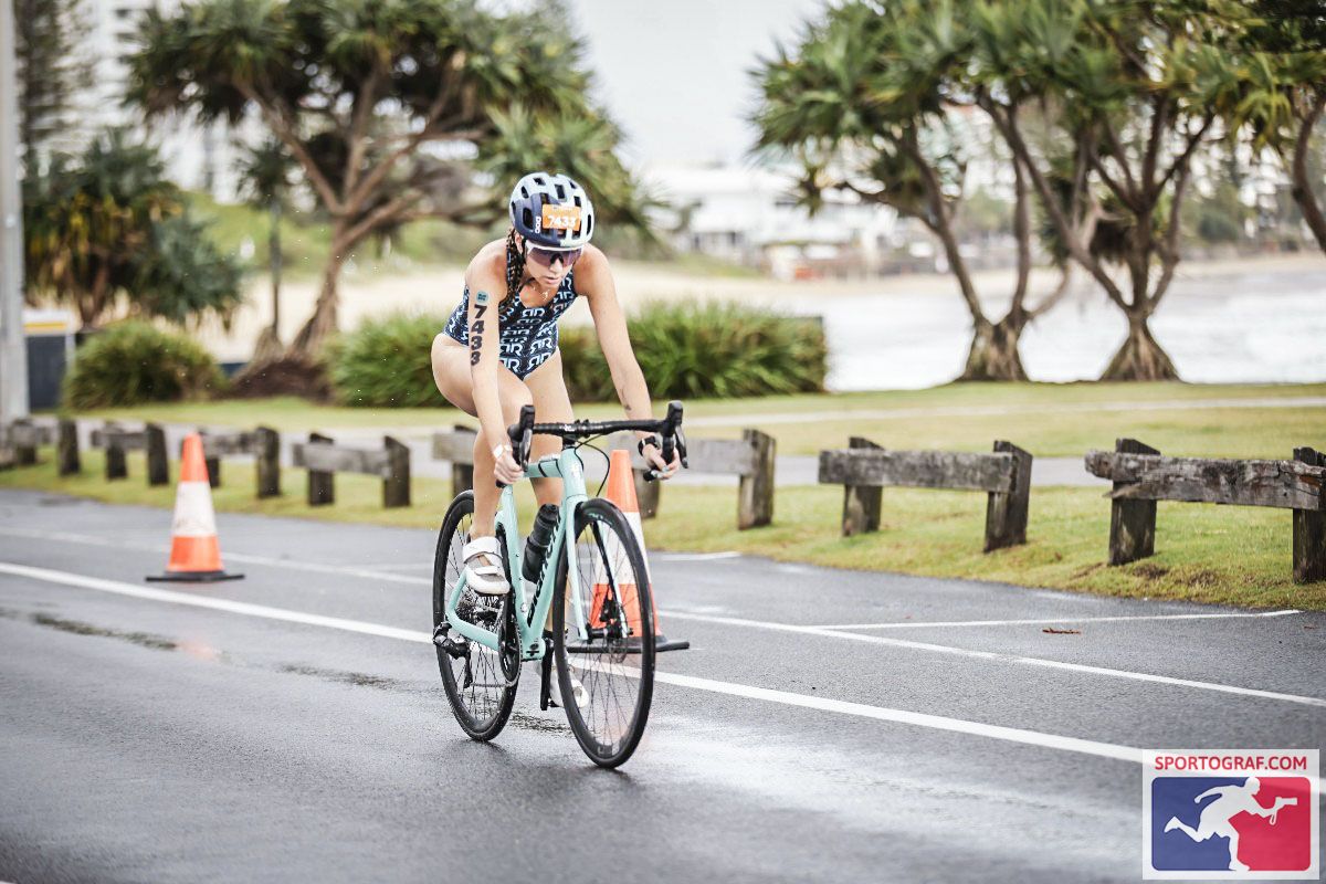 UQ student on bicycle