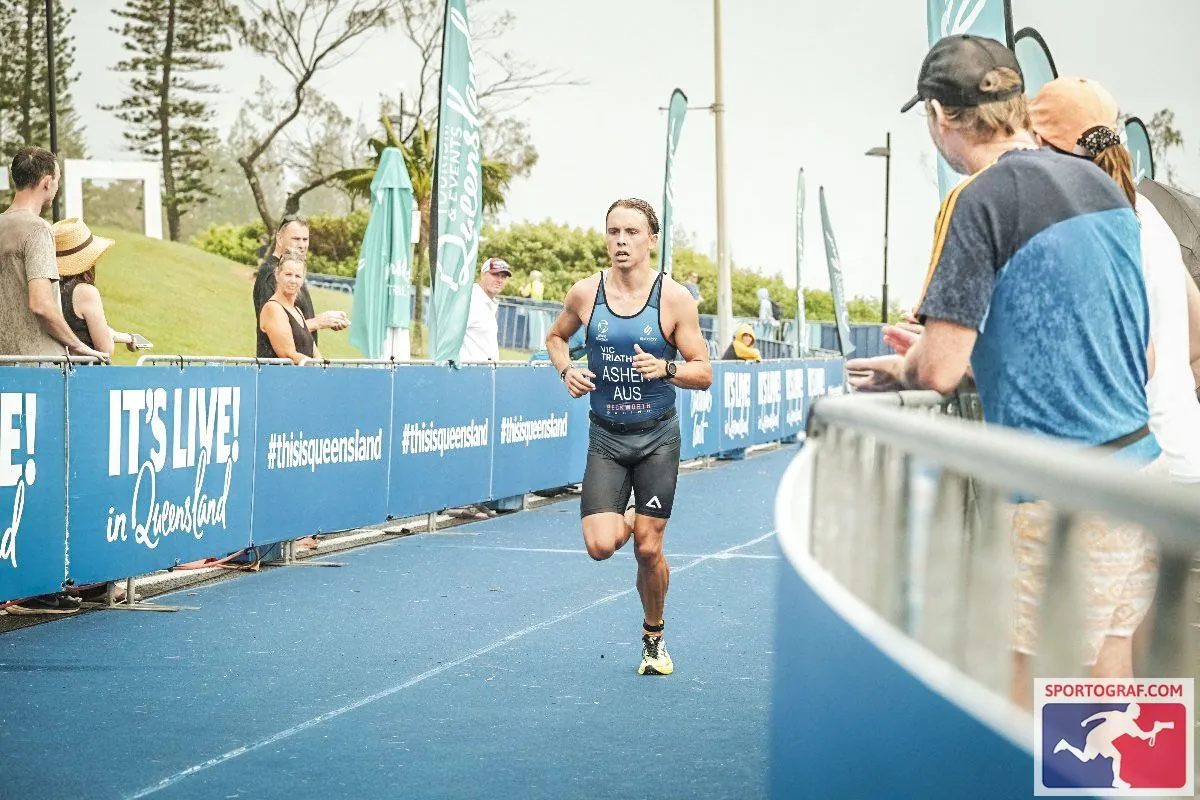 UniSC student running towards finish line